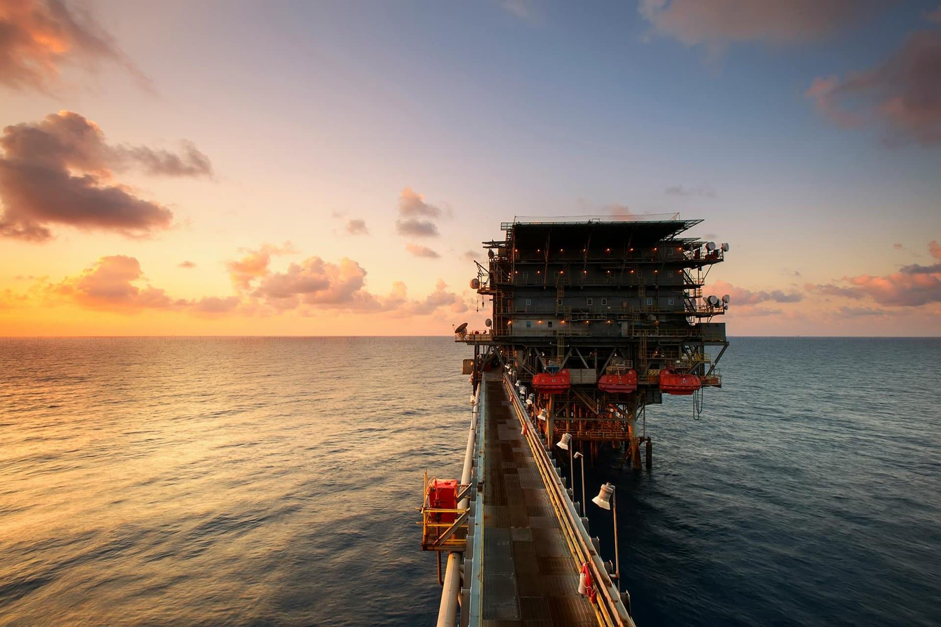 Cargo vessel at sea at dusk